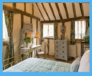 country cottage bedroom with exposed beams